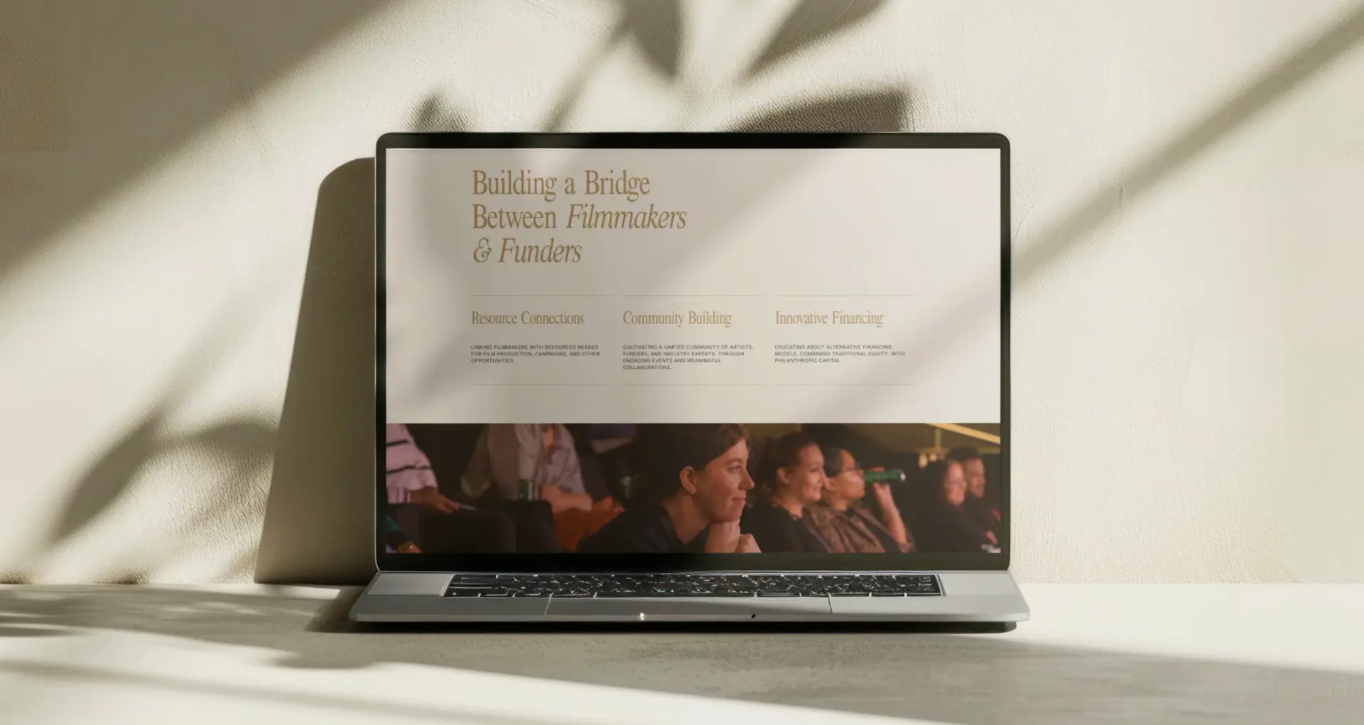 3Roots landing page section "Building a Bridge Between Filmmakers & Funders" on a laptop.
