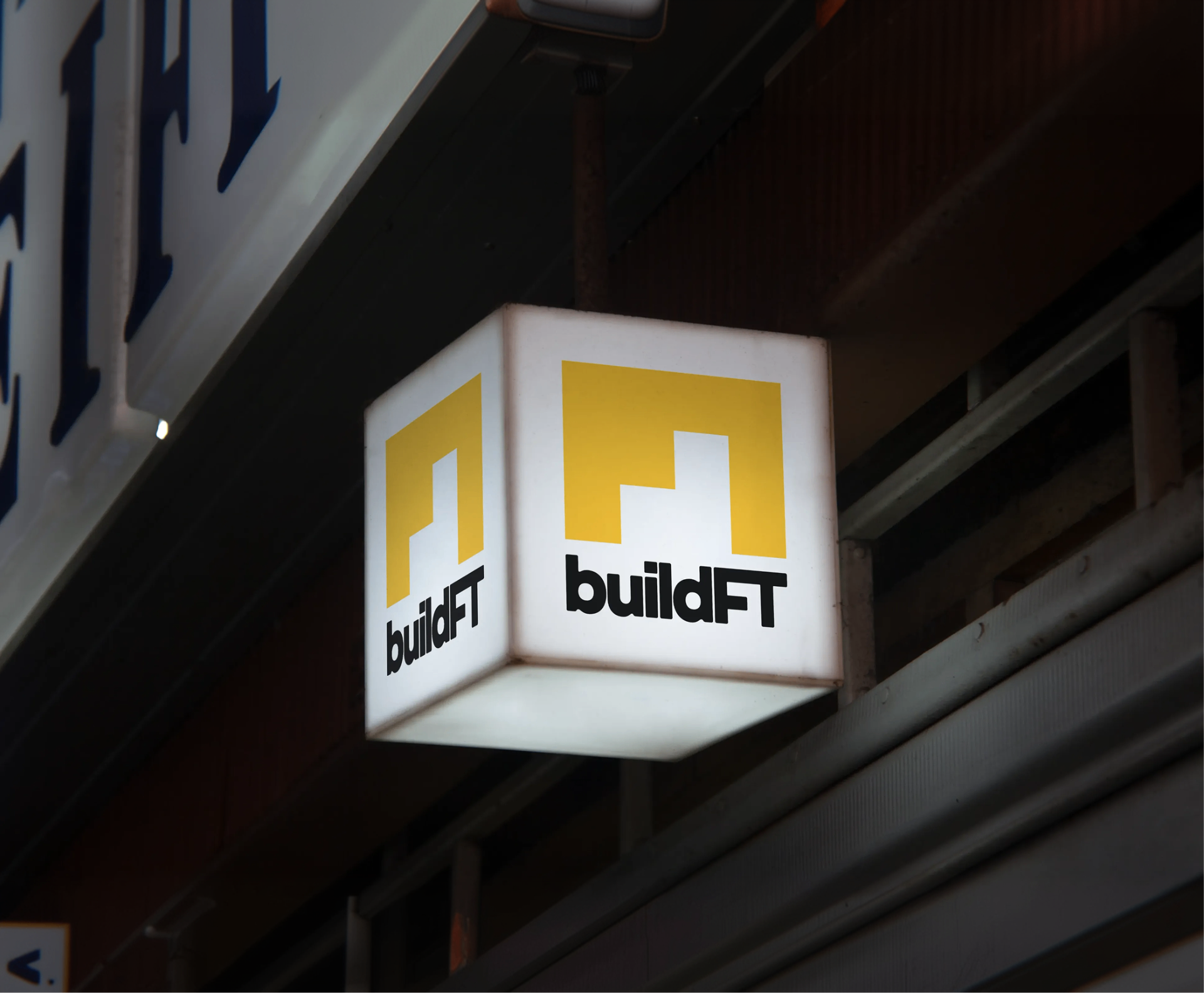 Illuminated BuildFT sign mounted on an exterior facade.