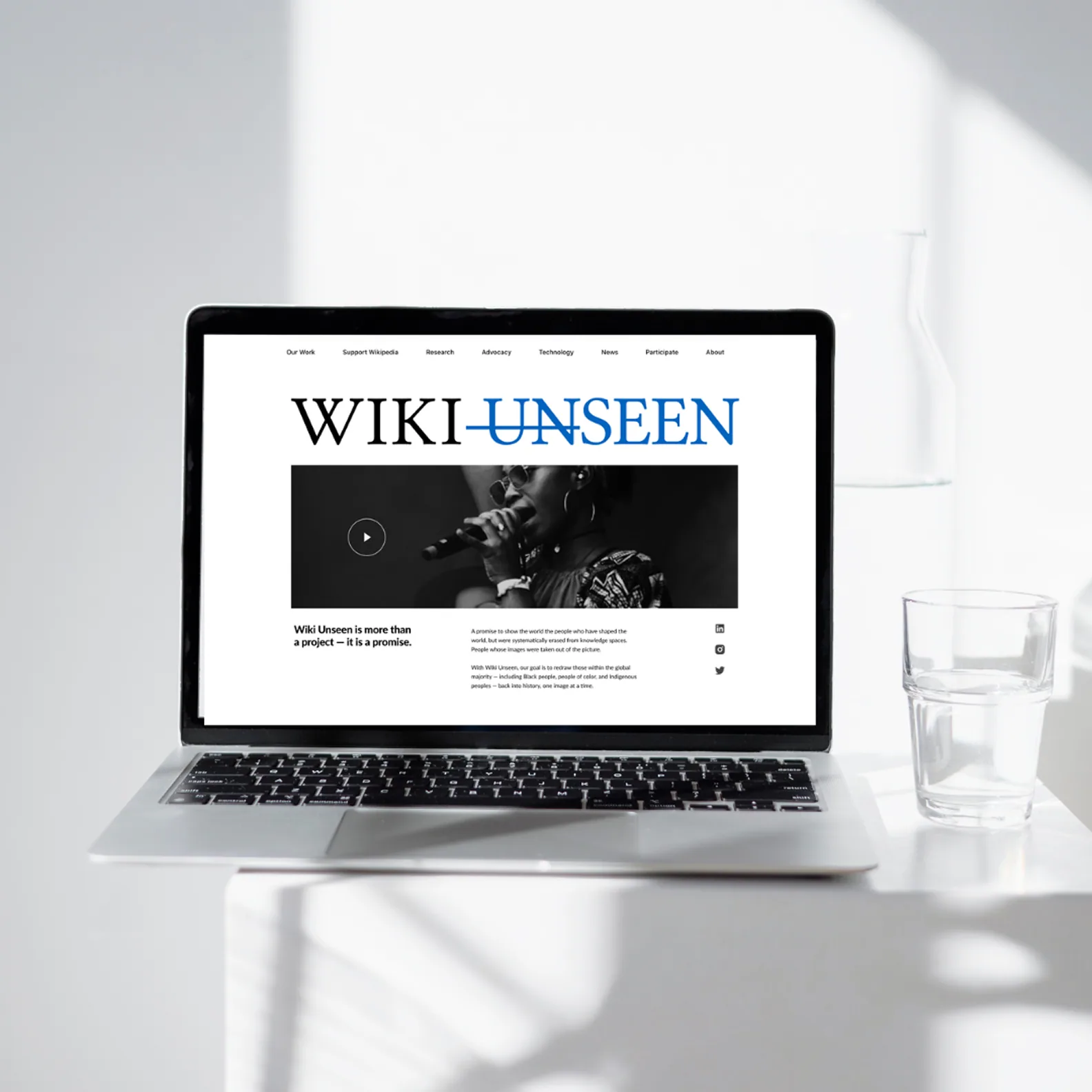 Wiki Unseen campaign page shown on a laptop.