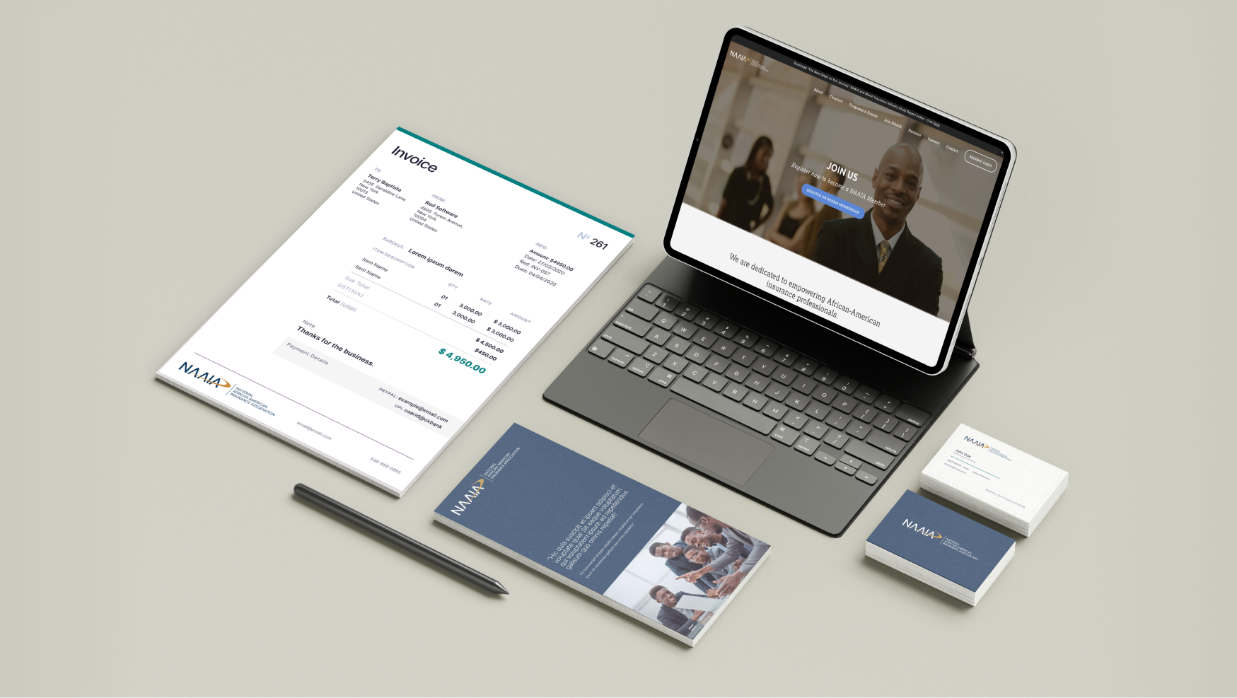 NAAIA branded stationery, membership brochure, and business cards on a desk.